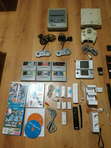 Lot 4 consoles et jeux vidéo Super Nintendo, Sega Master System et Dreamcast, DS